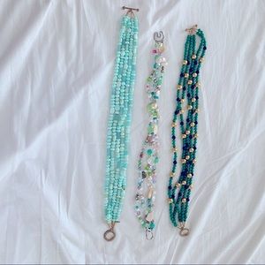 Bundle of beaded strand necklaces